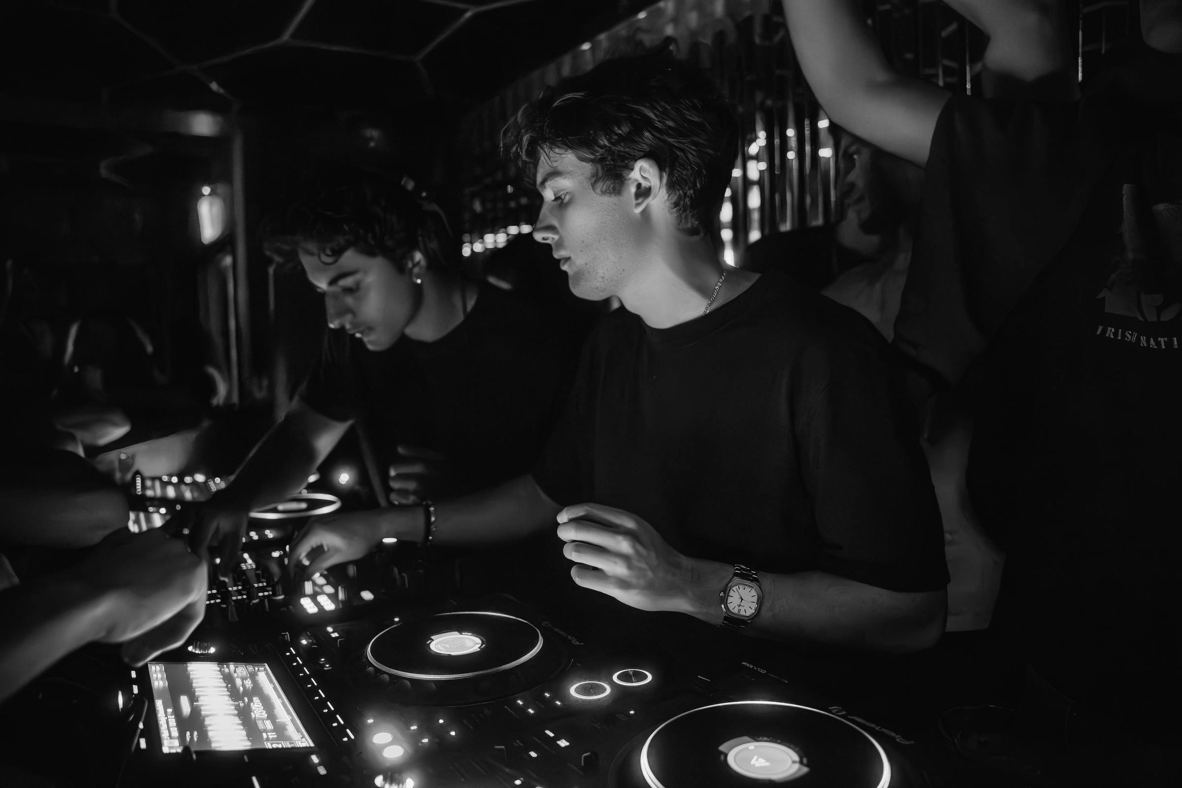 LUCOSIS at the decks, lit by the CDJ screens.